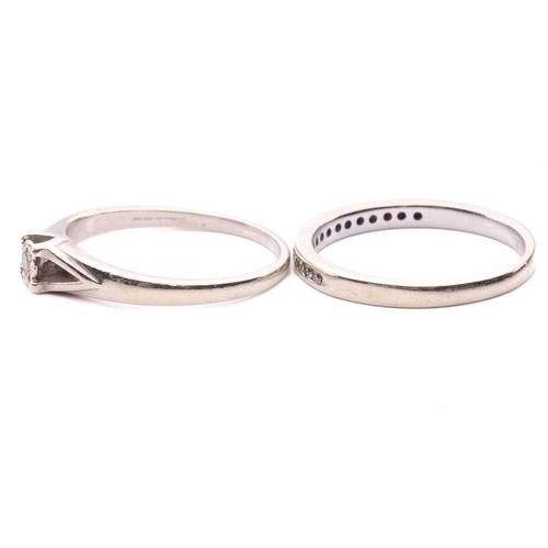 13 - A diamond solitaire ring, set with a round brilliant cut diamond with an estimated weight of 0.05ct,... 