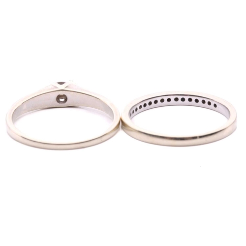 13 - A diamond solitaire ring, set with a round brilliant cut diamond with an estimated weight of 0.05ct,... 