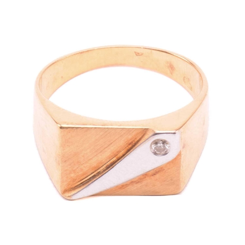 130 - An 18ct gold signet ring set with diamond, the rectangular ring head with brush finish, stylised wit... 