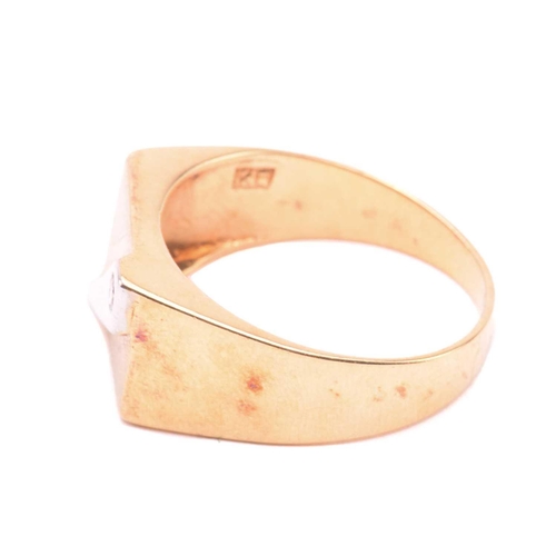 130 - An 18ct gold signet ring set with diamond, the rectangular ring head with brush finish, stylised wit... 