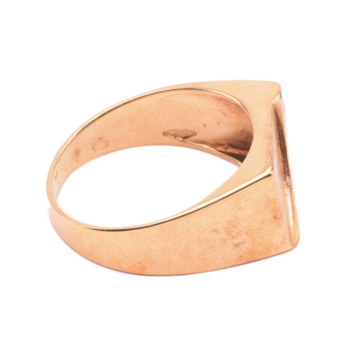 130 - An 18ct gold signet ring set with diamond, the rectangular ring head with brush finish, stylised wit... 
