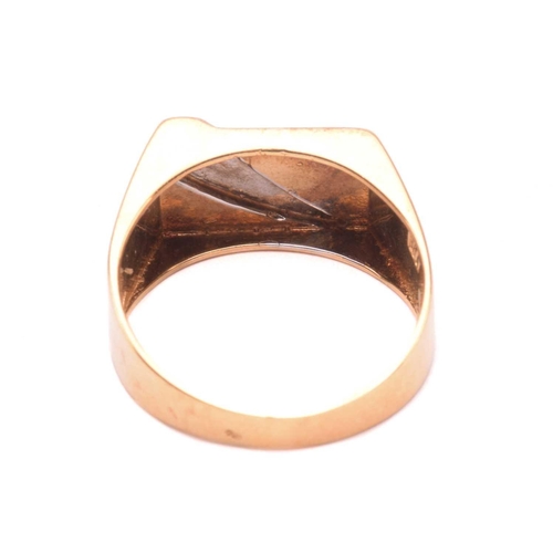 130 - An 18ct gold signet ring set with diamond, the rectangular ring head with brush finish, stylised wit... 