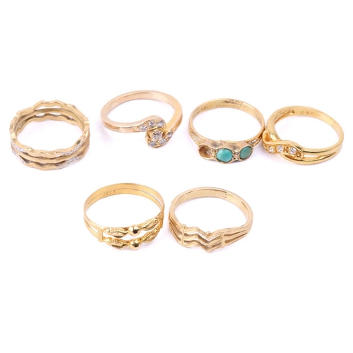 131 - Six yellow metal rings; to include a diamond-set crossover ring, size M; a three-stone turquoise hal... 