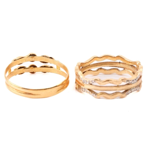 131 - Six yellow metal rings; to include a diamond-set crossover ring, size M; a three-stone turquoise hal... 