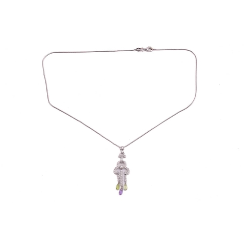 135 - A diamond, peridot and amethyst pendant on an 18ct white gold chain, of geometric design, comprising... 