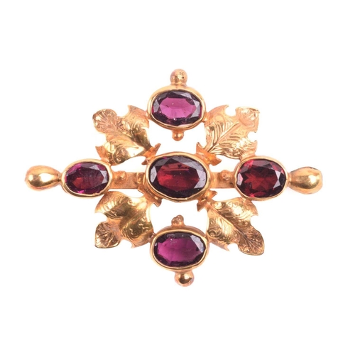 136 - A garnet pendant brooch, set with five garnets in a cross formation, the central garnet measuring 10... 