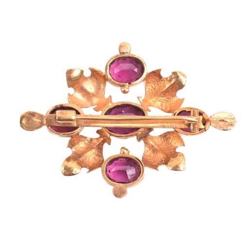 136 - A garnet pendant brooch, set with five garnets in a cross formation, the central garnet measuring 10... 