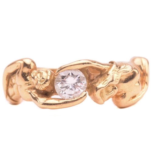138 - A French figural ring set with diamond, stylised as a man and woman hugging a brilliant-cut diamond,... 