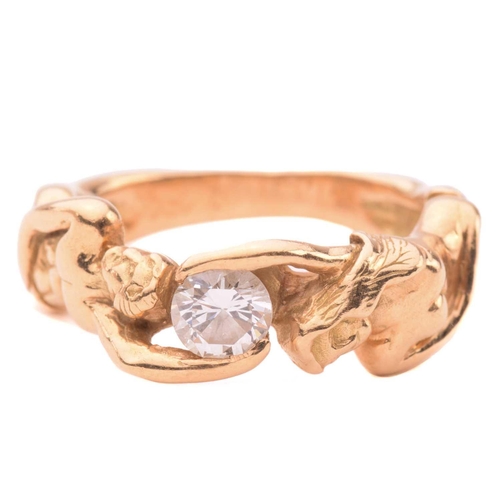 138 - A French figural ring set with diamond, stylised as a man and woman hugging a brilliant-cut diamond,... 