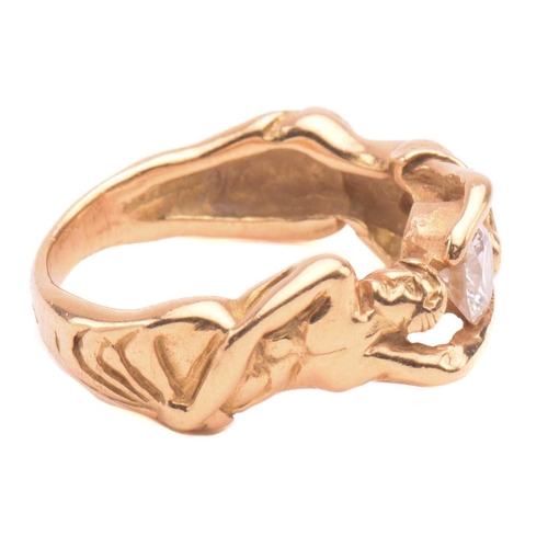 138 - A French figural ring set with diamond, stylised as a man and woman hugging a brilliant-cut diamond,... 