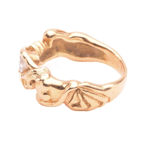 138 - A French figural ring set with diamond, stylised as a man and woman hugging a brilliant-cut diamond,... 