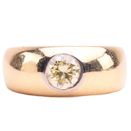 139 - A diamond gypsy ring, flush-set with a round brilliant-cut diamond of light yellow colour, with an e... 