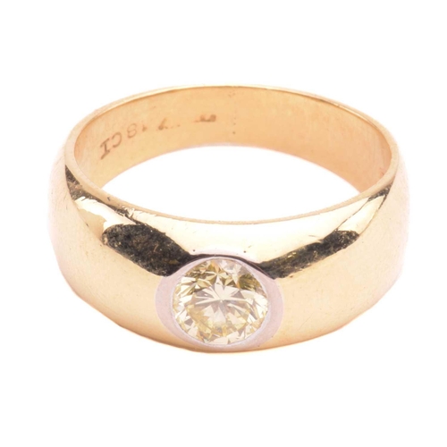 139 - A diamond gypsy ring, flush-set with a round brilliant-cut diamond of light yellow colour, with an e... 