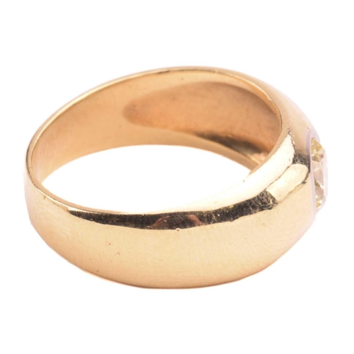 139 - A diamond gypsy ring, flush-set with a round brilliant-cut diamond of light yellow colour, with an e... 