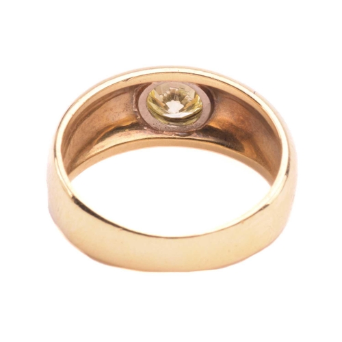 139 - A diamond gypsy ring, flush-set with a round brilliant-cut diamond of light yellow colour, with an e... 