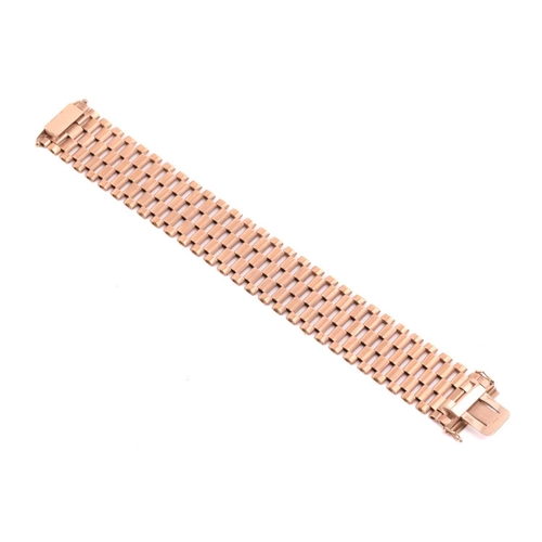 14 - A five-row panther link bracelet in 9ct yellow gold, completed with a concealed tongue clasp and dou... 