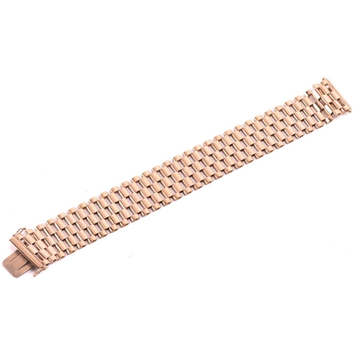 14 - A five-row panther link bracelet in 9ct yellow gold, completed with a concealed tongue clasp and dou... 