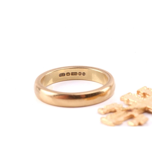 140 - An 18ct gold wedding band together with two religious pendants and a chain. The 18ct wedding ring me... 