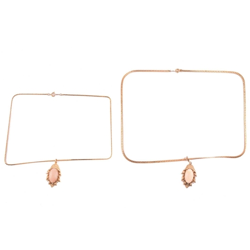 143 - Two coral-set pendants on chain together with matching clip-on earrings; the identical pendants of f... 