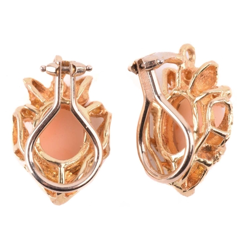 143 - Two coral-set pendants on chain together with matching clip-on earrings; the identical pendants of f... 