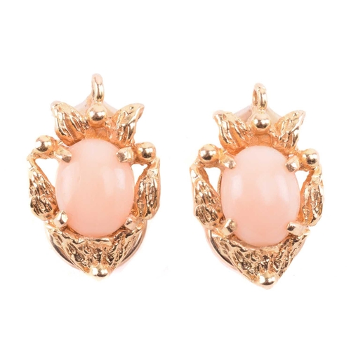 143 - Two coral-set pendants on chain together with matching clip-on earrings; the identical pendants of f... 