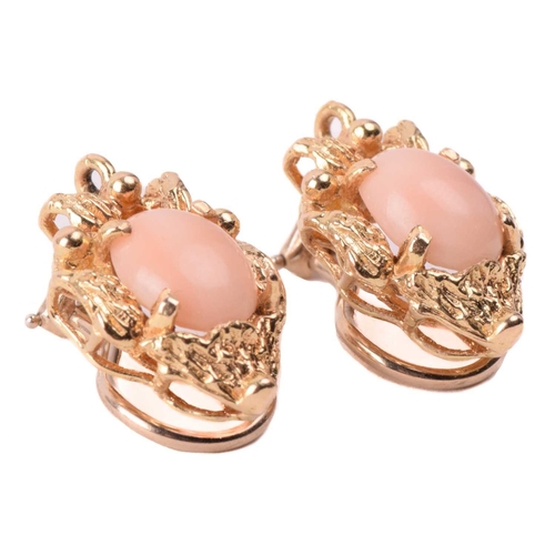 143 - Two coral-set pendants on chain together with matching clip-on earrings; the identical pendants of f... 