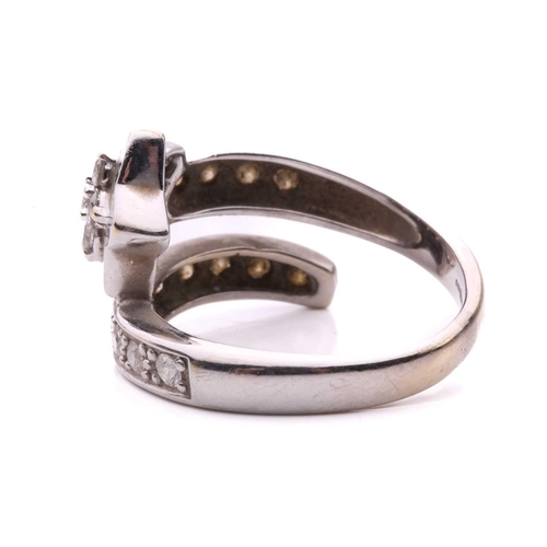 144 - A diamond set star ring, designed as a shooting star set with round brilliant cut diamonds with a to... 