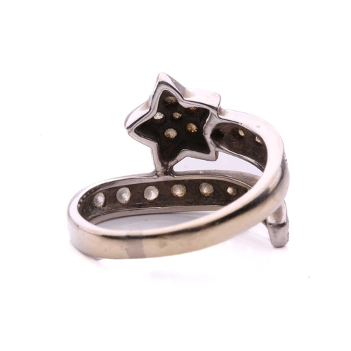 144 - A diamond set star ring, designed as a shooting star set with round brilliant cut diamonds with a to... 