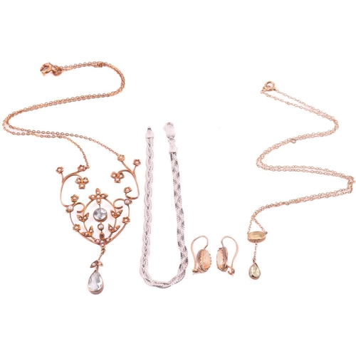 145 - An Edwardian styled aquamarine and seed pearl necklace and three others; the scrolling foliate centr... 