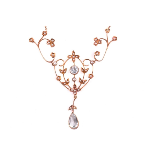 145 - An Edwardian styled aquamarine and seed pearl necklace and three others; the scrolling foliate centr... 