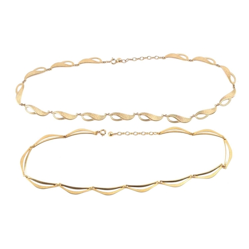 147 - A yellow metal fancy link necklace, composed of brushed finish crescent-shaped links and another sim... 