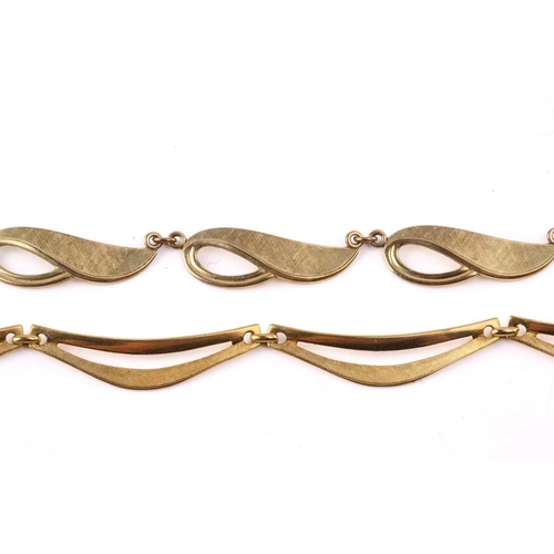 147 - A yellow metal fancy link necklace, composed of brushed finish crescent-shaped links and another sim... 