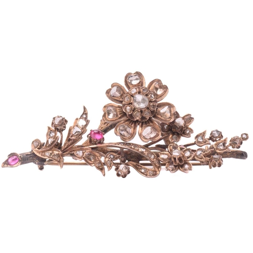 149 - A Mid-19th century Ottoman diamond and ruby floral brooch, designed as a spray of flowers set throug... 