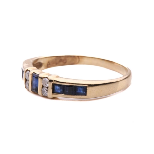 15 - A sapphire and diamond half-hoop ring, segments channel-set with square table-cut sapphires, flanked... 