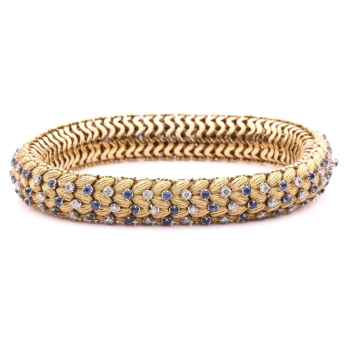 150 - Illario - a diamond and sapphire snake link bracelet, circa 1960, the articulated links of foliate d... 