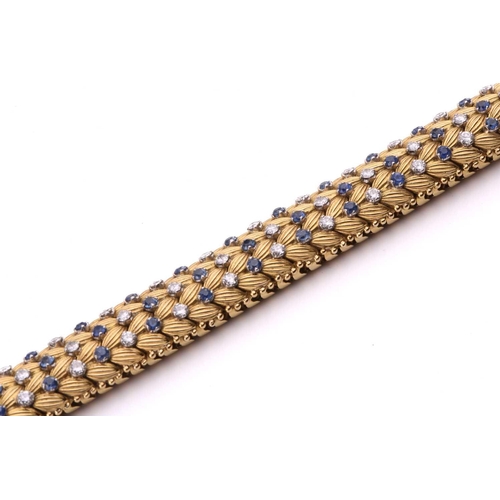 150 - Illario - a diamond and sapphire snake link bracelet, circa 1960, the articulated links of foliate d... 