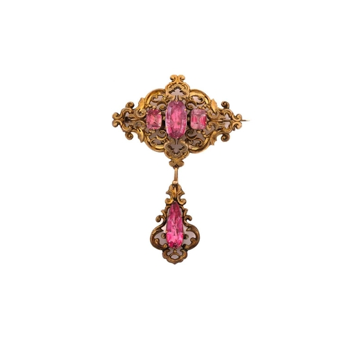 151 - An early to mid 19th-century topaz brooch; the central lozenge -shaped panel of open scrolling desig... 