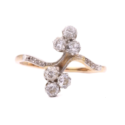 156 - A diamond trefoil cross-over ring set with round brilliant cut diamonds with a total estimated weigh... 