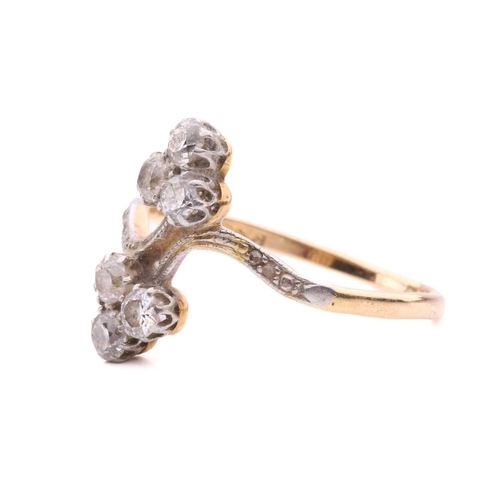 156 - A diamond trefoil cross-over ring set with round brilliant cut diamonds with a total estimated weigh... 