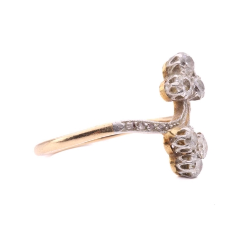 156 - A diamond trefoil cross-over ring set with round brilliant cut diamonds with a total estimated weigh... 