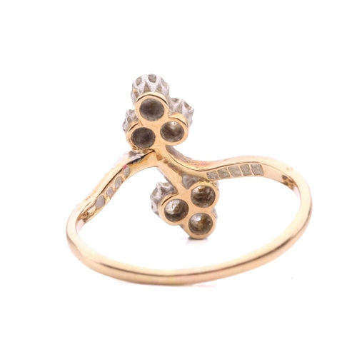 156 - A diamond trefoil cross-over ring set with round brilliant cut diamonds with a total estimated weigh... 