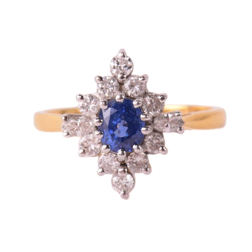 162 - A sapphire and diamond cluster ring, the central sapphire measuring 5.4mm x 4.5mm x 3.6mm, surrounde... 