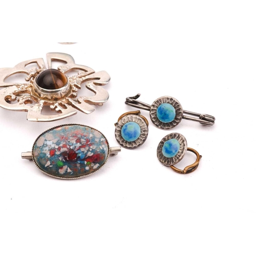 163 - A collection of Arts & Crafts jewellery; to include a shagreen-set silver pendant, of foliage design... 