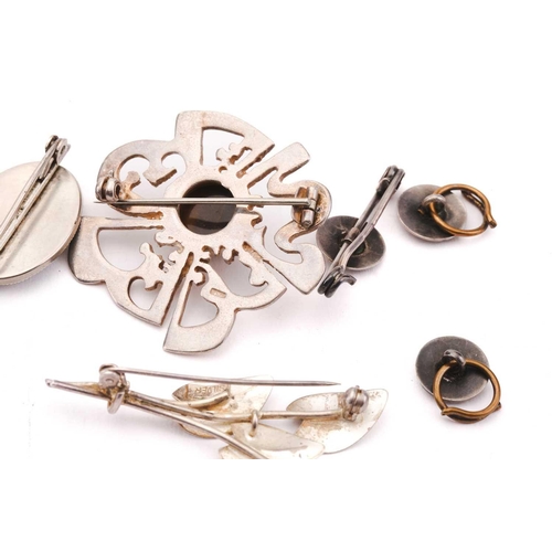 163 - A collection of Arts & Crafts jewellery; to include a shagreen-set silver pendant, of foliage design... 