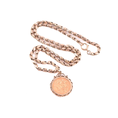 168 - A George V full sovereign pendant on chain; dated 1912, in 9ct gold scalloped mount, to an associate... 