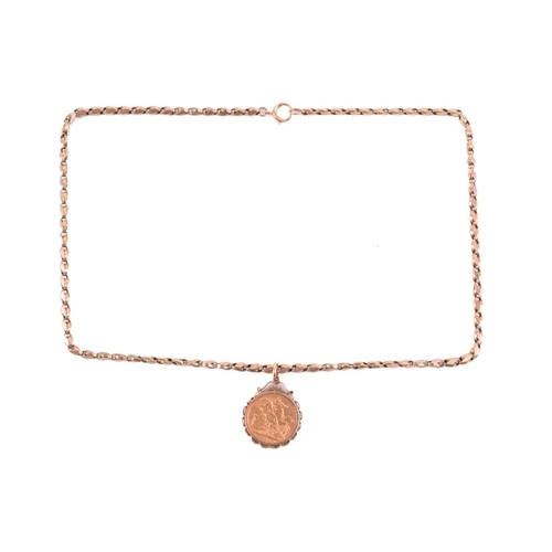 168 - A George V full sovereign pendant on chain; dated 1912, in 9ct gold scalloped mount, to an associate... 
