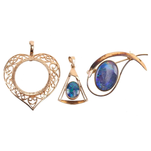 169 - An opal doublet pendant, with an abstract triangular design set to the centre with an oval opal doub... 