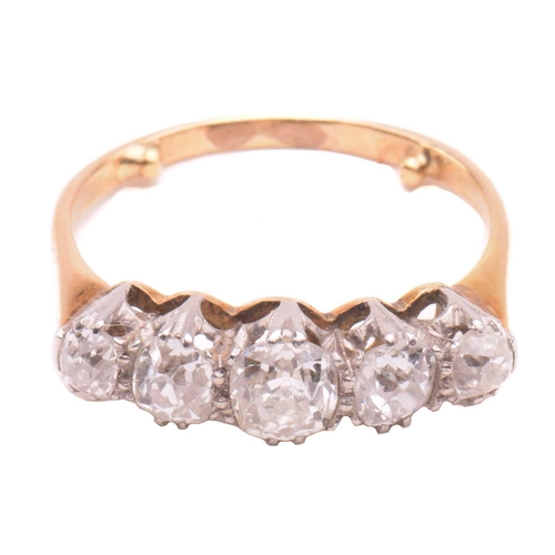 17 - A diamond five stone ring, set with a graduated row of cushion shape old cut diamonds with a total e... 