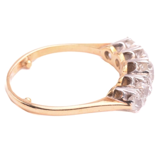 17 - A diamond five stone ring, set with a graduated row of cushion shape old cut diamonds with a total e... 