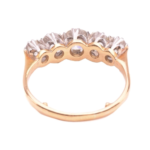 17 - A diamond five stone ring, set with a graduated row of cushion shape old cut diamonds with a total e... 